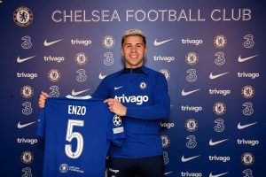 Enzo Fernandez hold his number 5 Chelsea Jersey